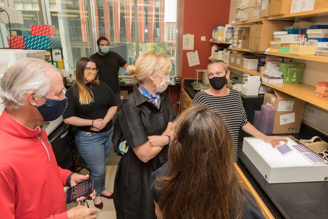 Deborah Birx, MD (center), coordinator of the White House Coronavirus Task Force, recently visited University of Arizona Health Sciences labs where researchers are testing antibody and antigen samples collected from students and employees. UArizona President Robert C. Robbins, MD (far left), joined her on the tour.