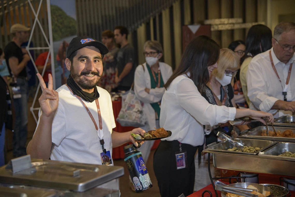 Irving Velazquez, program coordinator at the College of Medicine – Tucson’s Thomas D. Boyer Liver Institute, enjoys the reception after attending the UArizona Health Sciences Tomorrow is Here Lecture Series, “A New Era for Science: Creating New Defenses Against Disease After COVID-19” in Tucson.