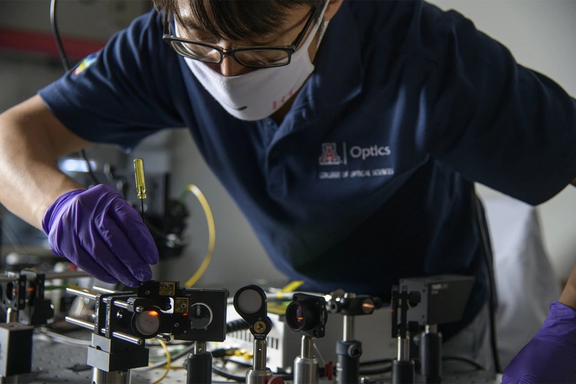 Dongkyun Kang, PhD, works on the laser light portion of a new, portable skin cancer diagnostic technology he is developing with Clara Curiel-Lewandrowski, MD.