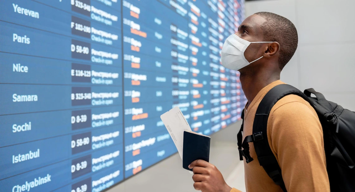 If you must fly, make sure to mask up in the airport and on the plane.