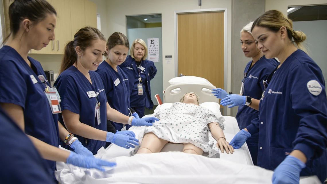 University of Arizona nursing students simulate patient care with a manikin at the College of Nursing in Gilbert, Ariz. in 2019.