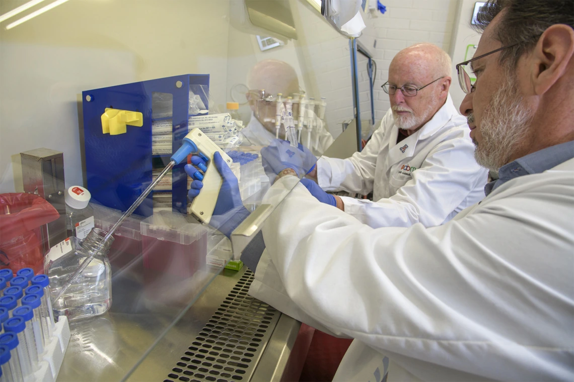 Michael Badowski, PhD, and David T. Harris, PhD, assemble sample collection kits in Harris’ lab in the Health Sciences Biorepository.