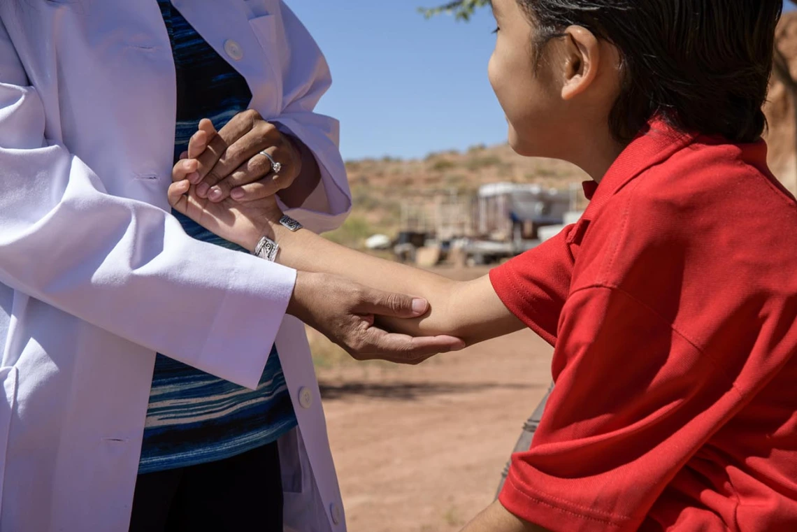 Vanessa Jensen, MD, helps drop off donations for Navajo residents at a community center in Tuba City. The supplies were gathered by University of Arizona College of Medicine – Tucson students who are involved with the Association of Native American Medial students (ANAMS) and the Rural health Professions Program (RHPP).