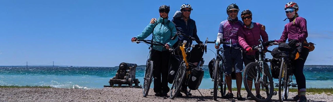 Friends joined the researchers on their tour, pictured here on the shore of Lake Michigan.