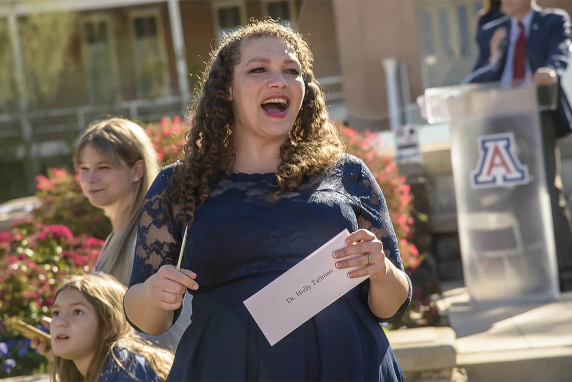 Holly Tallman prepares to open her letter that will tell her where she matched during the UArizona College of Medicine – Tucson 2022 Match Day event.