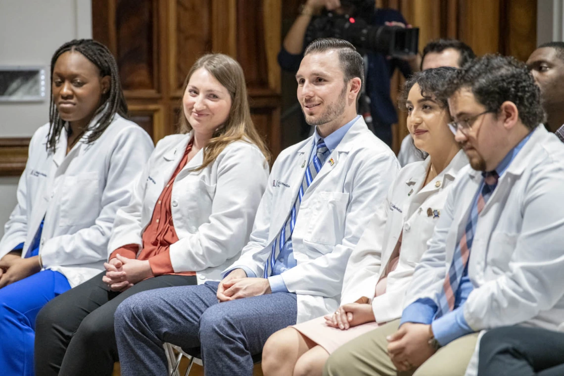 Primary Care Physician scholarship recipients listen to Dr. Carlos Gonzales speak during the reception. 