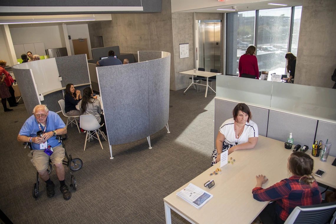 Grand opening attendees explore the Faculty Commons + Advisory inside the Health Science Innovation Building.