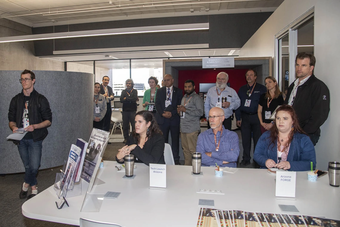 Faculty Commons + Advisory grand opening attendees listen to University of Arizona Senior Vice President of Health Sciences Michael D. Dake, MD. 