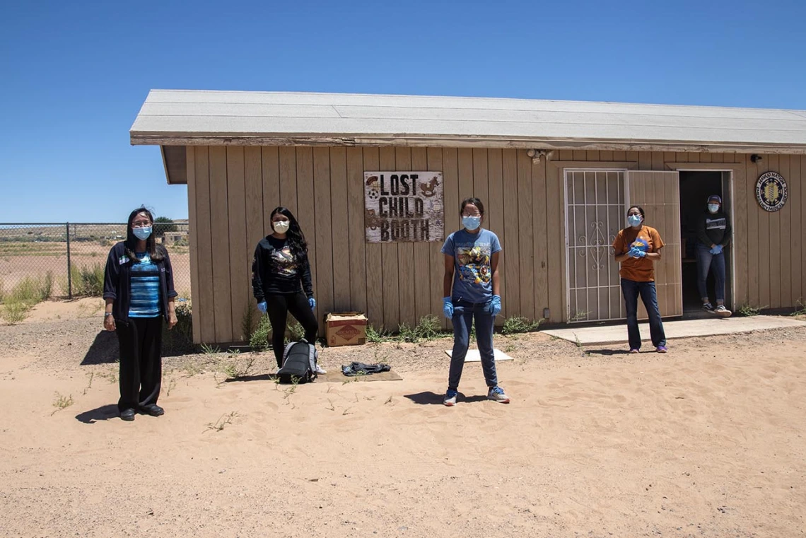 Vanessa Jensen, MD, stands with volunteers who help distribute supplies at a community center in Tuba City. 