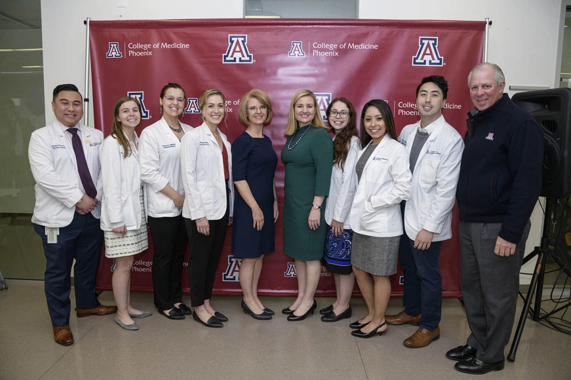 A group photo of Primary Care Physician scholarship recipients and community members.