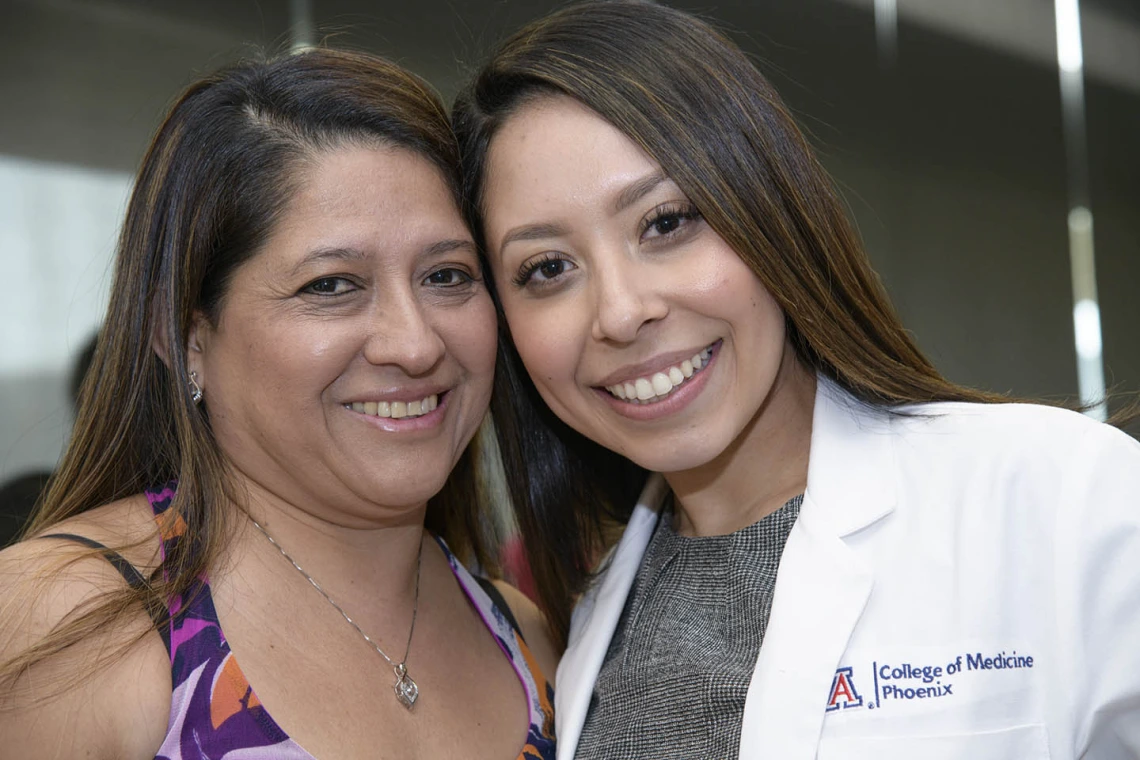 Primary Care Physician scholarship recipient Abigail Solorio poses for a photo with a family member. 