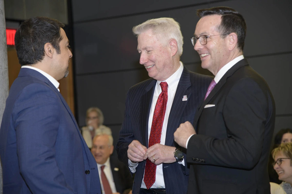 College of Medicine - Phoenix Dean Guy Reed, MD, and Associate Dean Glen Fogerty, PhD, socialize after the town hall in Phoenix.