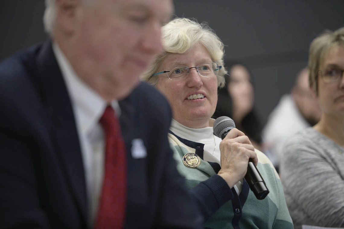 Lynda Ransdell, PhD, dean of Northern Arizona University’s College of Health and Human Services, asks a question during the town hall.