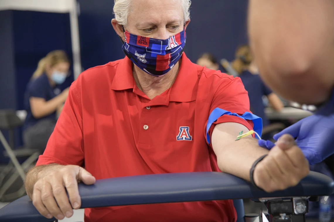 On April 30, the University of Arizona and the state of Arizona began an effort to test all frontline health care workers and first responders for antibodies to the virus that causes COVID-19. The first group included 4,500 first responders, health care workers, and some members of the general public from Pima County. UArizona President Robert C. Robbins undergoes a blood draw for his antibody test.