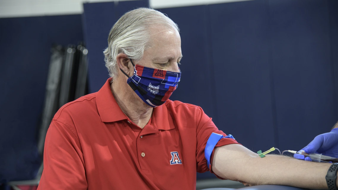 University of Arizona President Robert C. Robbins undergoes a blood draw for antibody testing.