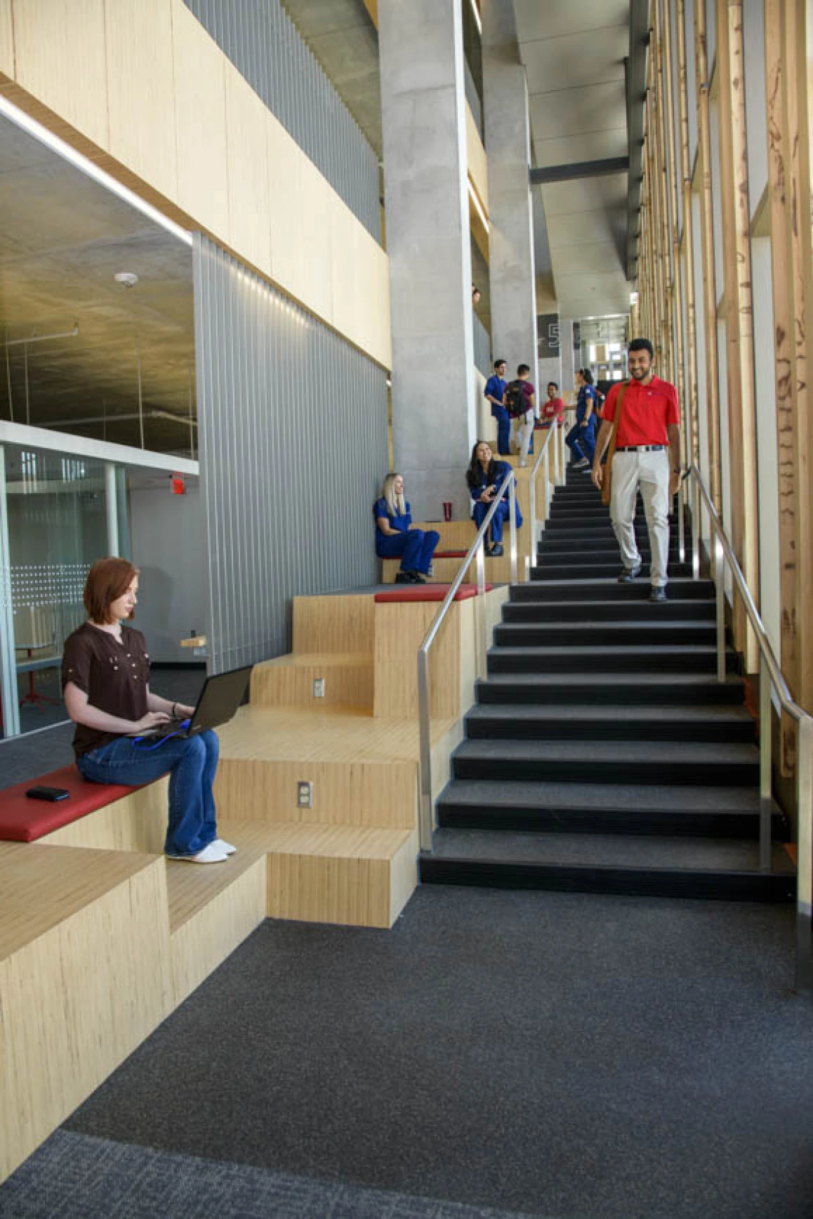 Study areas are nestled along a staircase that spans the east side of the building, making it easy to find a place to work alone or with a small group, aided by plenty of natural light.