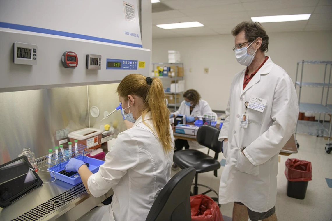 Research technician Anete Milkovica processes samples for testing. 