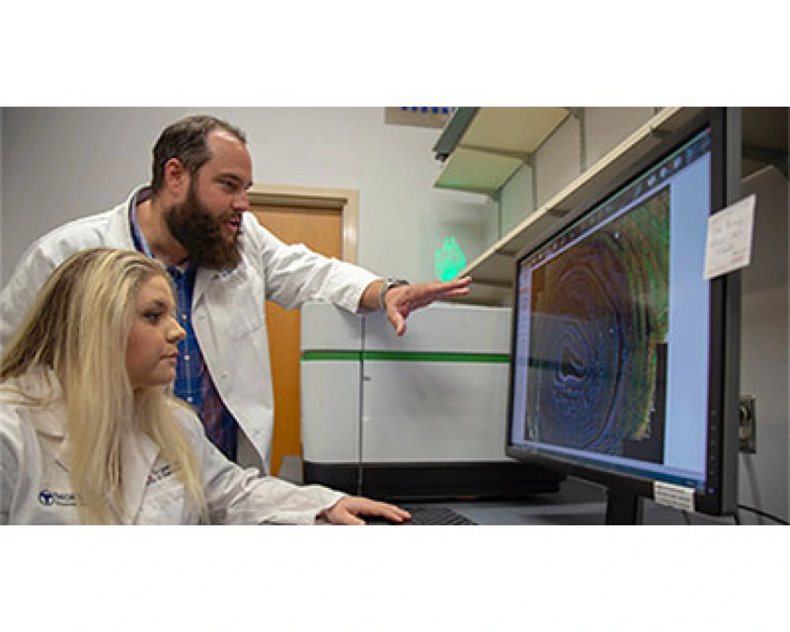 Curtis Thorne, PhD, assistant professor, cellular and molecular medicine, and one of his doctoral students, Carly R. Cabel.