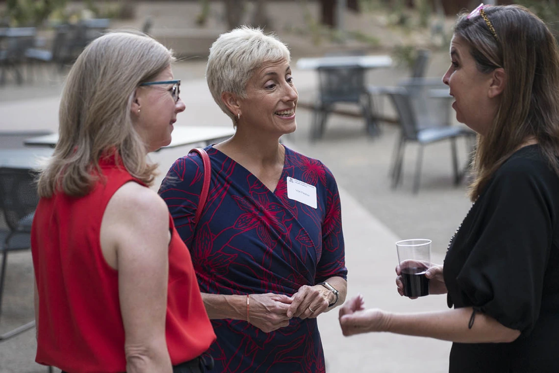 (From left) Anne Breckenridge Barrett, JD, MA, senior director for campaign and liaison to the executive office of the president for the University of Arizona Foundation; Vicki Fleisher, JD, senior vice president for development for the University of Arizona Foundation; and Carrie Whitten Simmons, senior manager for marketing, communications and engagement for the All of Us Research Program University of Arizona-Banner Health, visit after the first UArizona Health Sciences Tomorrow is Here Lecture Series in