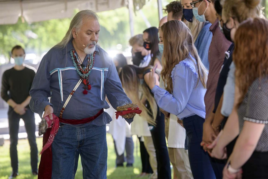 The herbs used in the smudging ceremony are white sage, soft sage, sweetgrass, creosote leaves, copal, cedar and wild tobacco.