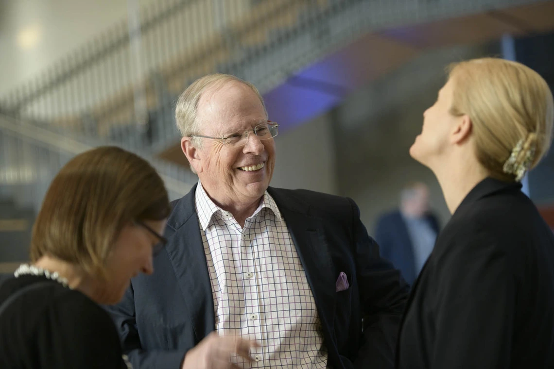 Attendees mingle inside the Health Sciences Innovation Building after the town hall event, Jan. 28, 2020. 