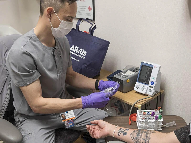 healthcare provider preparing blood for medical procedure