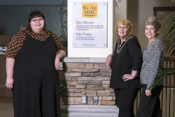 Project FUTRE graduates Madison Camacho (left) and Cynthia Garcia (middle) are apprenticing as family support specialists at the Marana Health Center, where supervisor Pauline Castillo (right) says their peer-to-peer counseling is making a difference in the lives of the families they help. 