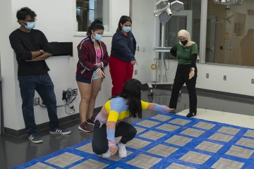 To successfully navigate the grid of “toxic” tiles, students had to learn from the missteps of those who went before them by identifying patterns and sequences of safe steps. 