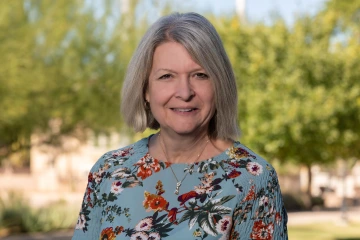 A portrait of Betty Parisek outdoors. 