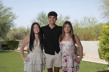 portrait of Peyton, Jack and Cameron Emens in the backyard at their home in Scottsdale, Arizona