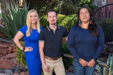 A posed group photo of three University of Arizona Cancer Center researchers