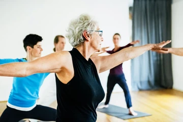 Older adult practicing yoga