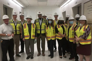 Researchers took a hard hat tour at the new location of the University of Arizona Health Sciences Center for Sleep and Circadian Sciences. (From left) Daniel Taylor, PhD, Michael Grandner, PhD, Fabian Fernandez, PhD, Sairam Parthasarathy, MD, Christopher Morton, Salma Patel, MD, Scott Killgore, PhD, Natalie Provencio, MS, Patricia Haynes, PhD, Sicily LaRue, RPSGT, Fiona Bailey, PhD, and Michelle Perfect, PhD.