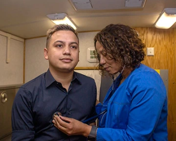 Family nurse practitioner Georgette George providing services at SAAF. Photo by Patricia Philbin.