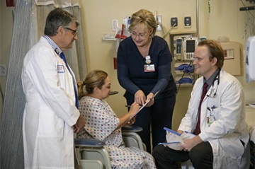 As a third-year UA College of Medicine medical student, Nicholas Gravbrot (right) is learning to interact with patients in a clinical setting, as well as working with physician-scientists, including Baldassarre “Dino” Stea, MD, PhD (left), on scientific research.