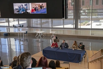 Before breaking into small groups, students participated in a Q&A to learn more about panelists’ experiences as people with disabilities. Panelists, from left: Mark Willits (top left, video conferencing from Phoenix), Curby Sickmon, Matthew Randle, and interpreter Kelly Hurlbut with Matthew Wangeman.