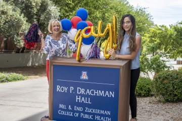 Chris Tisch, assistant dean of the Mel and Enid Zuckerman College of Public Health, and college employee Gisela Ochoa take a moment to celebrate during the college’s virtual ceremony filming.