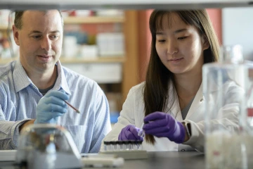 From left: John G. Purdy, PhD, assistant professor of immunobiology at the UArizona College of Medicine – Tucson, hopes to expand opportunities for postdoctoral researchers like Yeucheng Xi, PhD, with the support of the UArizona Health Sciences Personalized Defense strategic initiative.