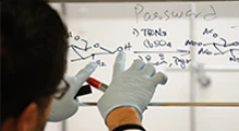 A researcher at the University of Arizona works on an equation (Photo: University of Arizona)