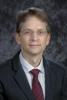 Portrait of Dr. Dedrick Jordan wearing a suit and tie