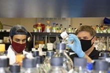 Dr. Tim Bolger and Peyman Aryanpur, a postdoctoral student in the Bolger Laboratory at the University of Arizona. (Photo: Michele Vaughn/UArizona Department of Molecular and Cellular Biology)