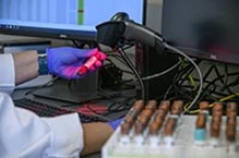 Lab technician Gina Delgado registers blood samples before they are processed to determine if they show antibodies to the virus that causes COVID-19. (Photo: Kris Hanning/University of Arizona Health Sciences)