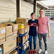 Darien Stratton and fellow UArizona medical student Josh Paree pick up groceries from Whole Foods.